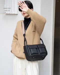 Black genuine leather crossbody bag for women, large capacity stylish tote with wide strap.