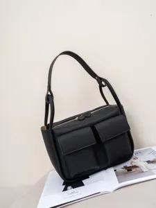 Togo genuine leather shoulder bag with double front pockets and spacious daily capacity.