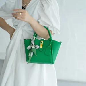 Green genuine leather bucket bag with lock charm and silk scarf for women stylish handbag.