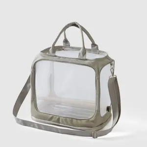 Transparent bird carrier bag detail, clear pet travel backpack with wooden perch inside.