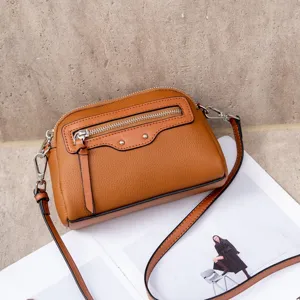 Brown genuine leather crossbody shoulder bag for women, stylish front zipper pocket, compact.