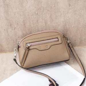Stylish leather crossbody bag for women, small shoulder bag with front zip pocket.