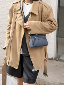 Stylish genuine leather crossbody bag with chic zipper details, perfect for daily commute and urban wear.
