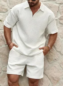 Detail view of waffle knit texture and zipper lapel on men's summer casual polo shirt.