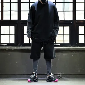 Detailed view of men casual streetwear t-shirt and shorts set in dark tone with layered design.