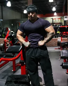 Detailed view of men's athletic short sleeve fitness training t-shirt in deep purple fabric.