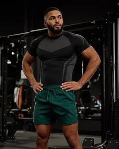Men's athletic compression t-shirt and shorts set, ideal for gym training and fitness workout.