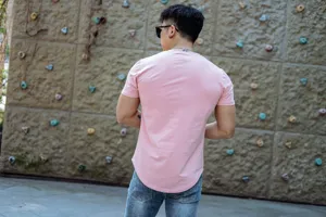 Back view detail of men's pink fitness t-shirt, casual athletic short sleeve training top.
