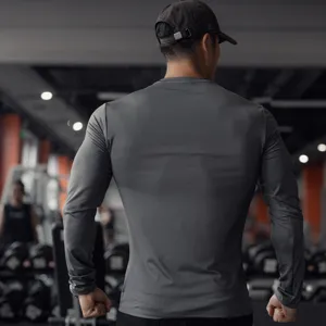 Detailed view of men long sleeve workout shirt, tight stretch running gym top for men.