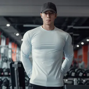 Men's light blue long sleeve sports fitness t-shirt, quick dry elastic gym workout base layer.