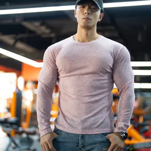 Men's long sleeve slim fit crew neck ribbed solid color fitness t-shirt for spring gym training.