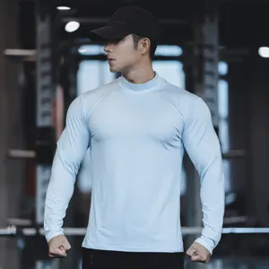 Men's light blue long sleeve athletic mock neck t-shirt, solid color quick dry workout fitness top.