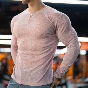 Detailed close-up shot of mens ribbed long sleeve slim fit t-shirt with button collar.