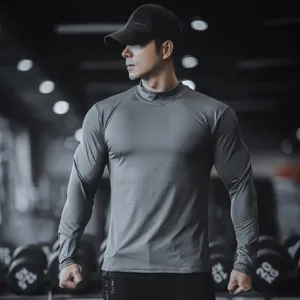 Detailed shot of mens solid color long sleeve fitness t shirt in gym setting, premium fabric.