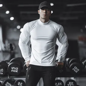 Gym fitness compression long sleeve shirt detail, solid white athletic base layer view.