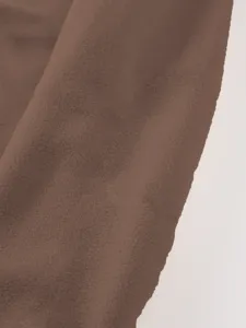 Bruine fleece stof detail close up zachte textuur materiaal stof staal bestellen