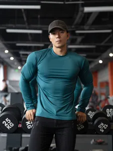 Men's solid color long sleeve athletic t-shirt, quick dry stretch fitness workout gym top.