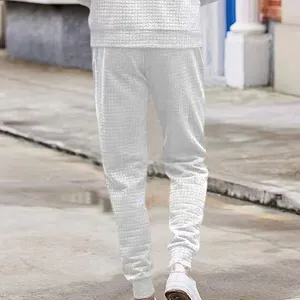 Men's casual waffle texture sweatpants, loose fit outdoor drawstring tapered active pants.
