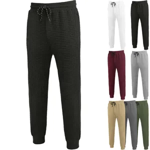 Men's waffle knit casual sweatpants with adjustable drawstring and tapered cuffs for daily wear.