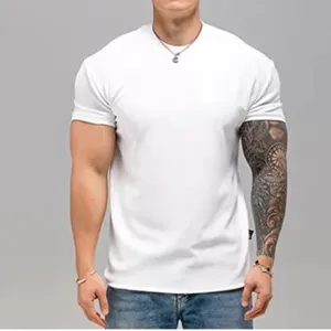 Detail view of a men's plain white short sleeve t-shirt, showing the fit and casual style.