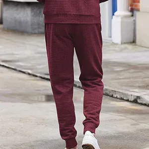 Men's casual waffle knit tapered trousers, stylish textured drawstring sweatpants for autumn.