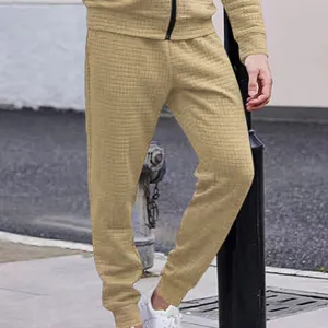 Mens waffle knit tracksuit set casual solid color zip jacket and slim fit sweatpants.