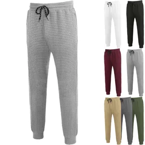 Men's casual waffle knit sweatpants with drawstring and tapered legs, comfortable fit.