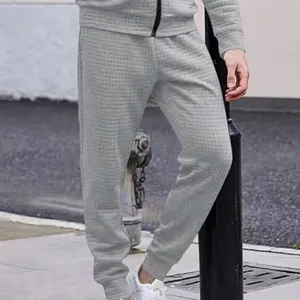 Men's grey waffle knit casual sweatpants, stylish textured tapered joggers for daily wear.