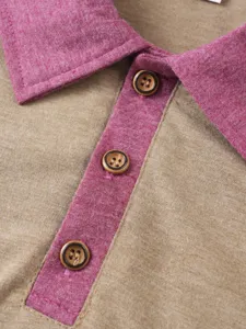 Close-up detail shot of men's polo shirt featuring knit contrasting collar placket and buttons.