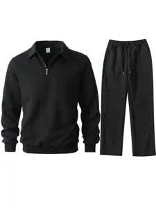 Ensemble survêtement noir homme sweat polo demi-zip et pantalon texturé maille jacquard.