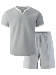 Waffle knit fabric detail of the gray short sleeve V-neck top and casual sportswear shorts set.