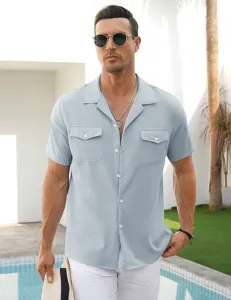 Men's light blue short sleeve linen blend shirt detail view showing chest pockets and lapel collar.