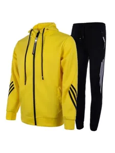 Men's casual athletic tracksuit set with yellow zip hoodie and black pants with stripes.