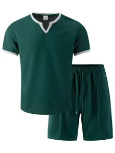 Detailed view of men's waffle knit short sleeve V-neck t-shirt and breathable casual shorts set.