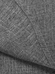 Men's shirt detail fabric close-up showing grey cotton linen texture material design.