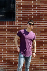 Detail view of men's casual purple short sleeve t-shirt, comfortable fit for daily streetwear.