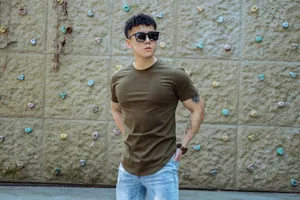 Outdoor fitness apparel detail showing a men's solid army green crew-neck short sleeve t-shirt.