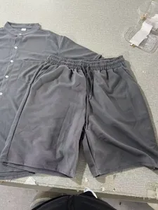 Detail view of men waffle knit short sleeve shirt and casual shorts set in solid grey color.