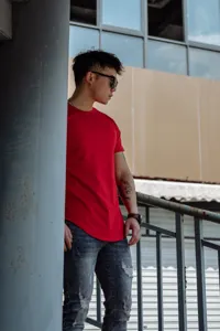 Detailed view of casual men's red short sleeve t-shirt, comfortable fit for daily wear.