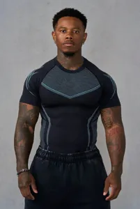 Close-up detail of mens athletic short sleeve compression shirt with blue knit texture details.