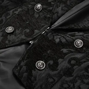 Close-up of black gothic steampunk jacquard jacket fabric and detailed metal lion buttons.