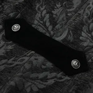 Close-up detail of black gothic steampunk jacket brocade fabric velvet tab metal buttons.