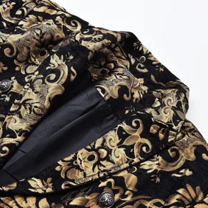 Close-up detail of mens gothic black and gold brocade jacquard coat fabric and metal buttons.
