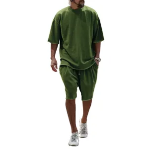 Detail view of the casual olive green oversized short sleeve t-shirt and shorts streetwear set.