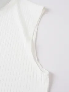 Detailed close-up view of white ribbed knit sleeveless men's tank top showing fine texture.