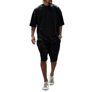 Detailed view of men's vintage washed oversized short sleeve t-shirt and shorts set.