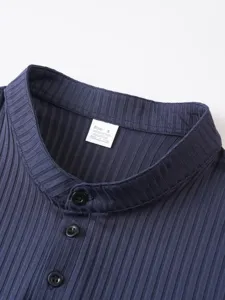 Detailed view of men's ribbed sleeveless henley vest collar with button closure in dark blue.