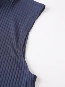 Detailed view of the dark blue ribbed knit sleeveless vest, showing fine fabric texture.