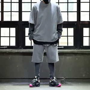 Detailed view of the loose-fit casual grey t-shirt and matching shorts outfit for men.