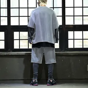 Men's casual loose short sleeve t-shirt and shorts set, trendy layered streetwear outfit.